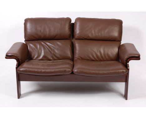 A Danish formed laminate two-seater brown leather upholstered sofa by Jeki, w.148cm