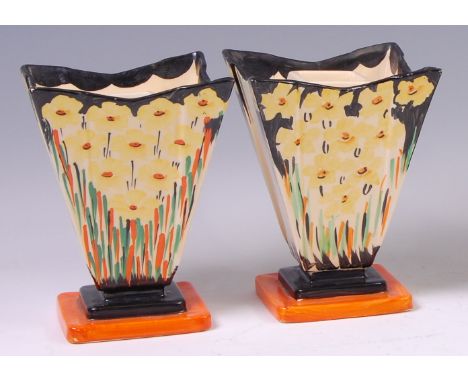 A pair of Myott & Son Art Deco ceramic stepped pedestal vases, each of square tapering form, with bright colour floral painte