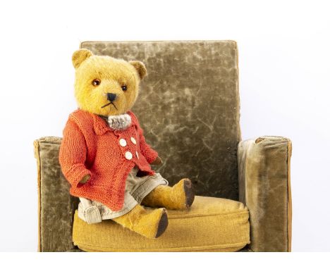 A 1940s Chiltern Hugmee teddy bear,  with golden mohair, orange and black glass eyes, black stitched nose and mouth, swivel h