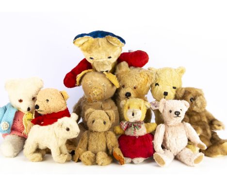 Various vintage teddy bears,  including a blue, yellow and red unjointed bear, a Jane Hissey's Old Bear  --16½in. (42cm.)high