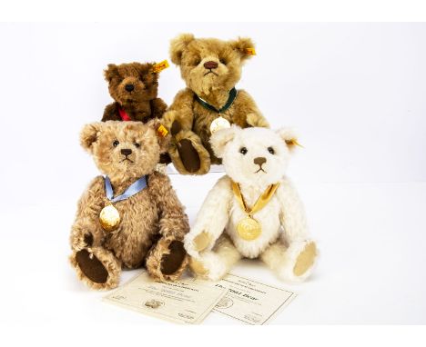 Three Steiff Danbury Mint Year teddy bears, for the years 2000- 2002, certificates for 2001 and 2002, and a Steiff yellow tag