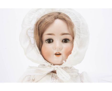 A Schoenau &amp; Hoffmeister 914 child doll,  with brown lashed sleeping eyes, light brown mohair wig jointed composition bod