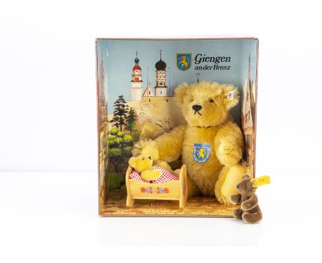  A Steiff Giengen Teddy Bear Set, including a blonde mohair teddy bear and baby bear in wooden cradle, 2516 of a limited edit