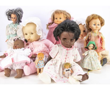 Nine vinyl dolls, including a brown Chiltern --18in. (46cm.) high; a Fisher Price girl and others (some playwear)
