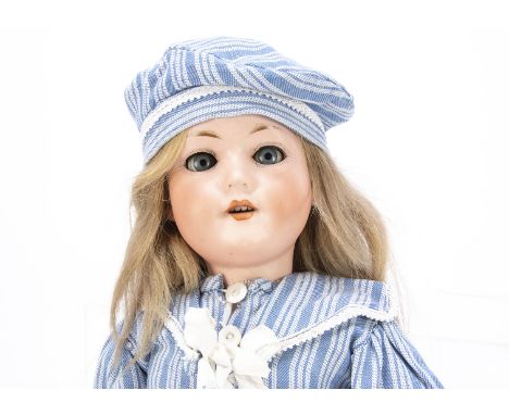 An Armand Marseille 390 child doll,  with blue sleeping eyes, recent blonde wig, jointed composition body and light blue and 