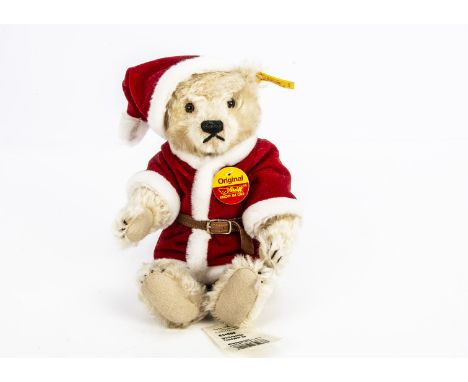 A Steiff yellow tag Christmas teddy bear,  dressed as Father Christmas --10in. (25.5cm.) high