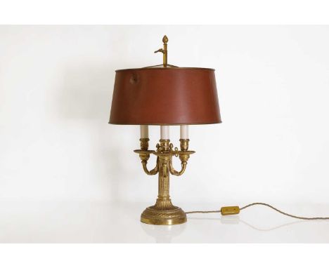 A Directoire-style ormolu three-light bouillotte lamp,19th century, French, with adjustable red tole shade,37cm diameter60cm 