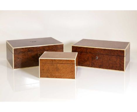 A group of three burr wood and ivory cigar boxes, c.1930s, to include an example of rectangular form fitted with a Bramah loc