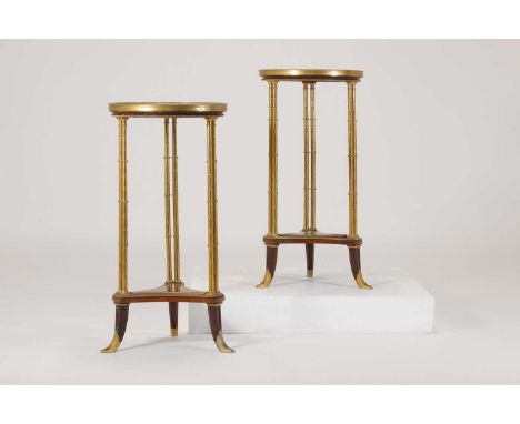 A pair Louis XVI-style mahogany, amboyna and ormolu guéridons,first half of the 20th century, after the model by Adam Weiswei