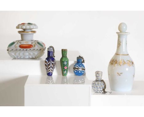 A moulded, painted and gilt-heightened opaline glass inkwell,mid-19th century French, in the manner of Baccarat, 7cm high,an 