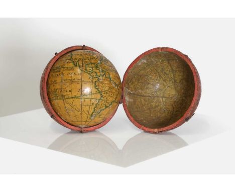 A George III 2¾-inch pocket globe,c.1776, by Lane of London, inscribed 'A New Globe of the EARTH by N. Lane 1776', in a red s
