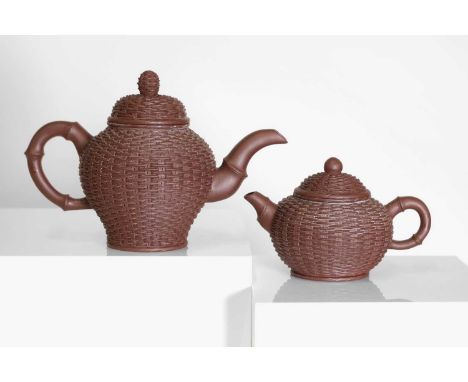 Two Chinese Yixing zisha stoneware teapots, 20th century, each rounded body imitating strips of bamboo, with a four-character