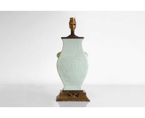 A Chinese celadon vase,late Qing dynasty, the compressed body rising from an everted rectangular foot, flanked by two bat han