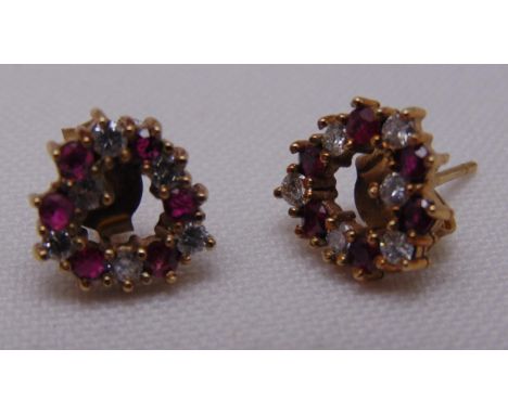 A pair of 9ct gold, diamond and ruby heart shaped earrings, approx total weight 2.2g