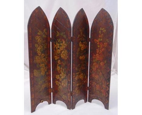 A four panel Victorian table screen of lancet form, the hinged panels decorated with flowers and leaves, 73.5 x 69cm