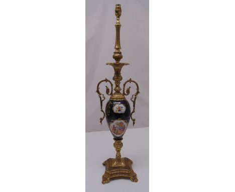 A gilt metal and porcelain table lamp on raised square base with scroll feet, 89cm (h)