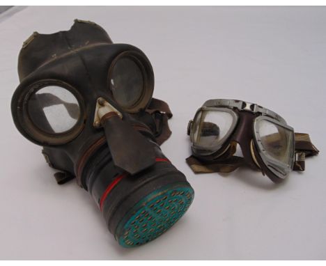 WWII gas mask and a pair of vintage motor cycle goggles