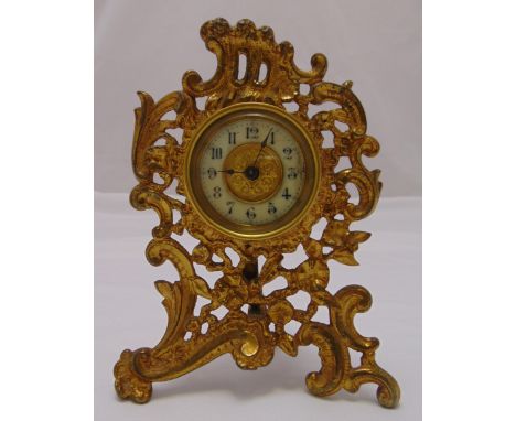 A gilded metal desk clock in Rococo style frame with white enamel chapter ring and Arabic numerals, 16.5cm (h)