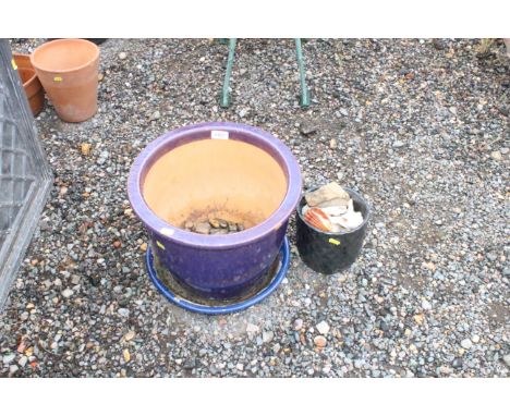 A glazed planter and a small plant pot and contents of shells