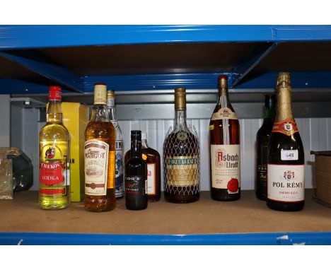 A bottle of German brandy; a bottle of Three Barrels brandy; Queen Margo Scotch whisky etc