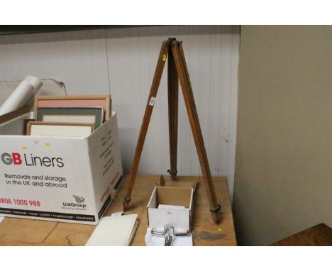 An adjustable wooden tripod