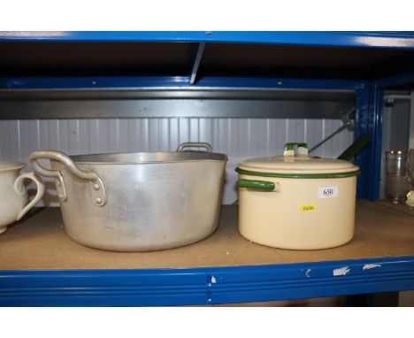 An enamel saucepan with lid and a twin handled pan