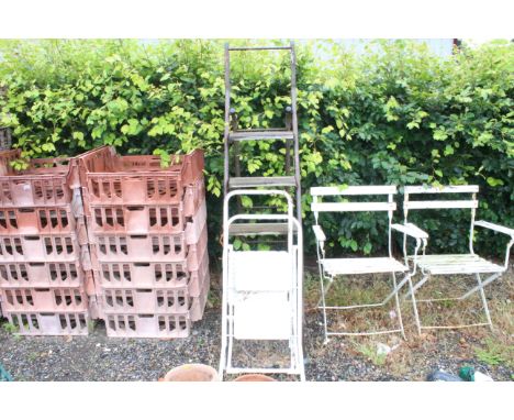Two step ladders and a wooden and metal larger step ladder