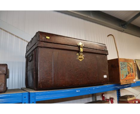 A metal travelling trunk and a fold out clothes line