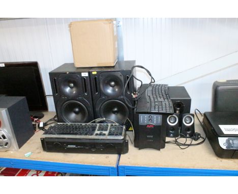 Three Logitech speakers; a Samsung studio amplifier; an APC Smartups 1500; a pair of Behringer B2031P speakers and two comput