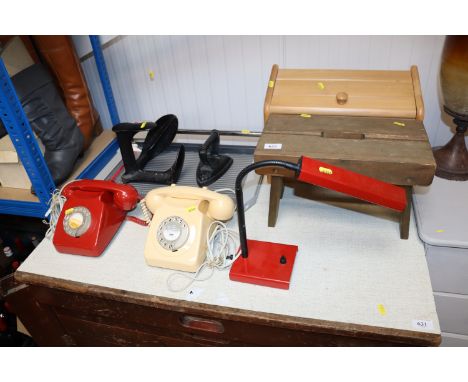 A wooden stool; a bread bin; a desk lamp; a guillotine; a shoe last; flat iron and two rotary dial telephones