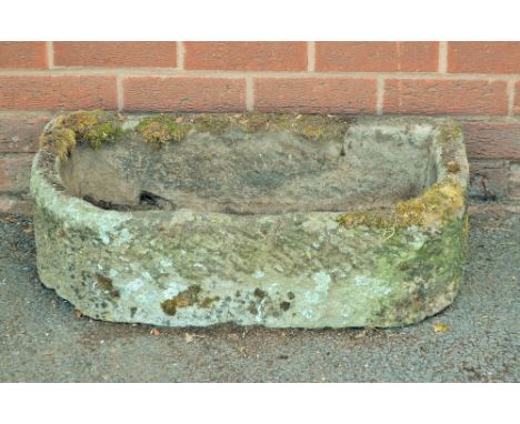 A demi-lune stone trough