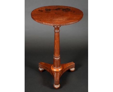 A George IV mahogany tripod occasional table, circular top, turned pillar, incurved canted triform base, bun feet, 73cm high,