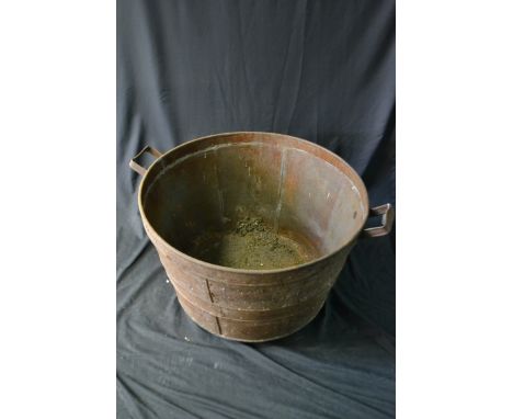 A large galvanised tapering cylindrical three-handled garden trough, approx. 77cm diameter