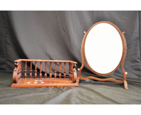 A mahogany book trough and an Edwardian mahogany mirror