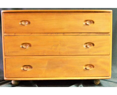 An Ercol chest of three drawers