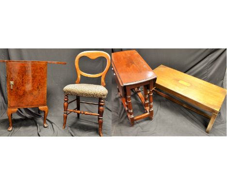 A walnut bedside cabinet, with folding top; a campaign style coffee table; a gateleg table; a Victorian balloon back chair