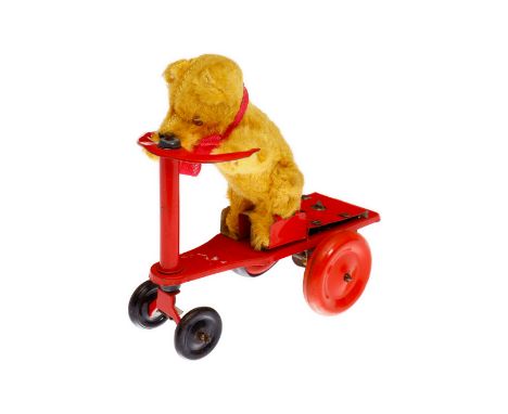 Teddybär auf Roller, Uhrwerk intakt, LS und Alterungsspuren, L 11,5, Z 2-3