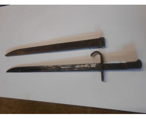 Bayonet with Scabbard missing wood from handle. Bayonet 20 inches long overall