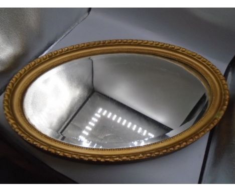 Vintage oval gilt bevelled mirror