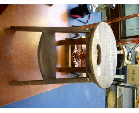 FOLDING WOODEN STOOL WITH 'CATALOGUE OF GARDEN SEEDS J & R. THYNE' TOP H: 17" D: 11.5"