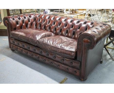 CHESTERFIELD SOFA, 78cm H x 200cm W x 90cm D, burgundy leather on castors. 