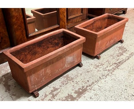 ITALIAN GARDEN TROUGH PLANTERS, a pair, weathered terracotta raised on glazed loose ceramic feet, 35cm H x 72cm L x 34cm. (2)
