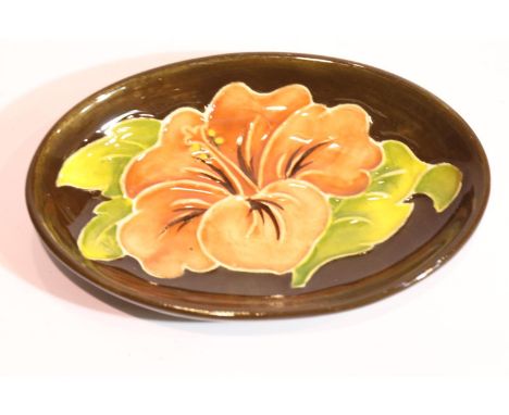 Moorcroft ceramic footed pin dish in the brown Hibiscus pattern, L: 11.5 cm. P&amp;P Group 1 (£14+VAT for the first lot and £