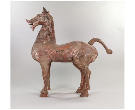 Ca.206 BC–220 AD. A large ceramic horse in a static pose, powerful built, muscular with long legs, erect mane, open mouth wit