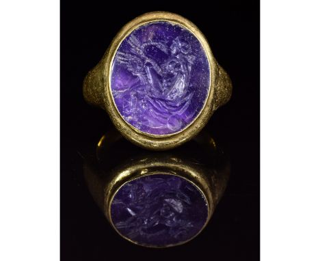 Ca. 200 AD. Important Roman legionary gold ring with finely carved intaglio; oval-shaped hollow hoop; elliptical bezel with a