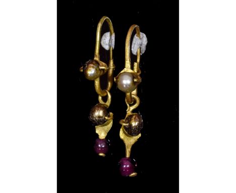 Ca.300 AD. A matched pair of gold earrings, each flat-section hoop with amethyst bead finial, bell-shaped dangle with pearl b