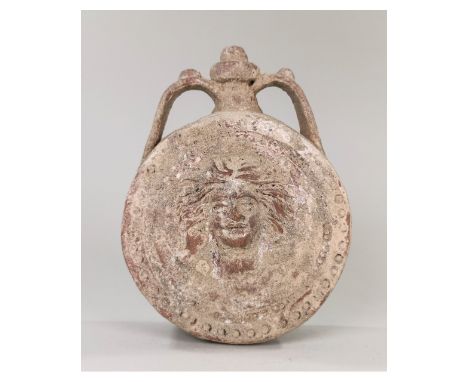 Ca.100-200 AD. A Roman earth-ware terracotta flask, with a relief portrait of Janus - In ancient Roman religion and myth, Jan