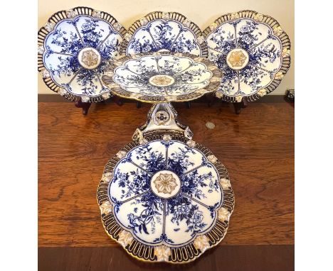 CERAMIC TAZZA AND FOUR PLATES TO ACCORD, CIRCA 1900, PIERCED AND GILDED DECORATION
