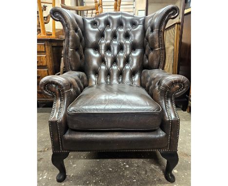 Early 20th century leather upholstered button back Chesterfield wing armchair. Approx. 109 x 95 x 93cms
used with scuffs scra