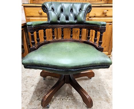 20th century green leather button upholstered swivel office armchair. Approx. 86cms H
reasonable used with minor scuffs scrat